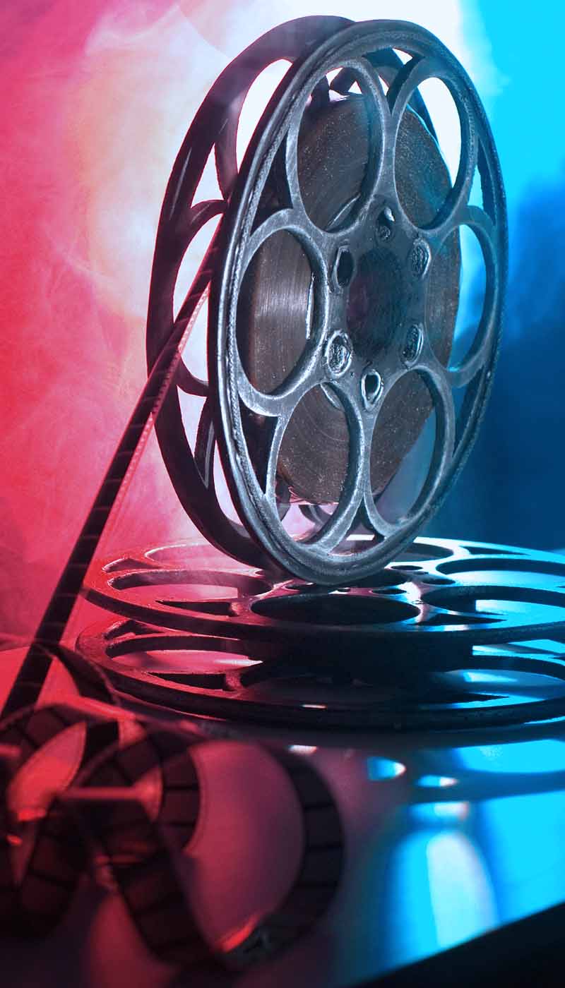 Film reel in colorful lights
