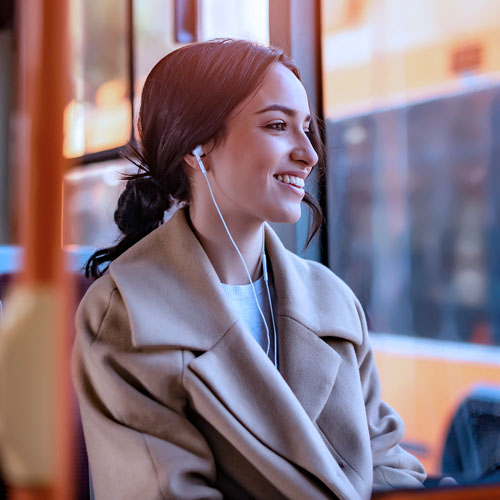 Happy young woman with headphones on