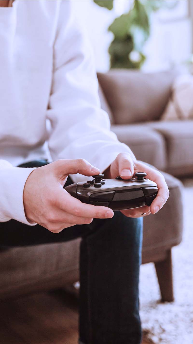 Close up of man holding video game controller