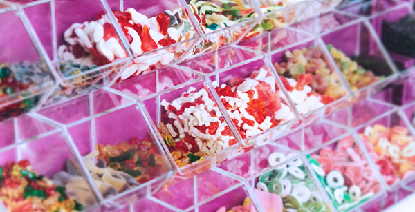 A wide array of candy in bins at the candy shop
