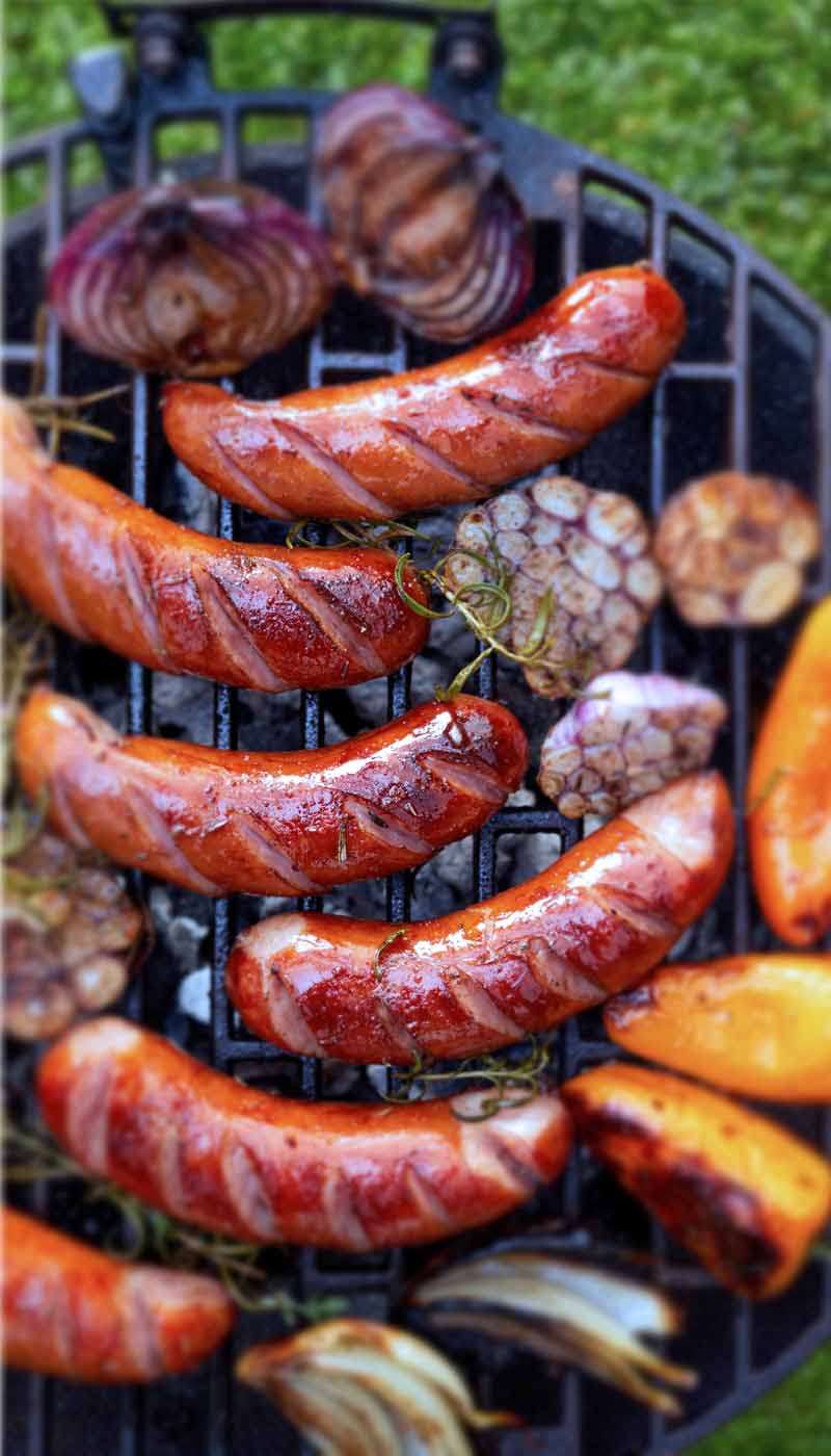Veggies and sausages on a grill